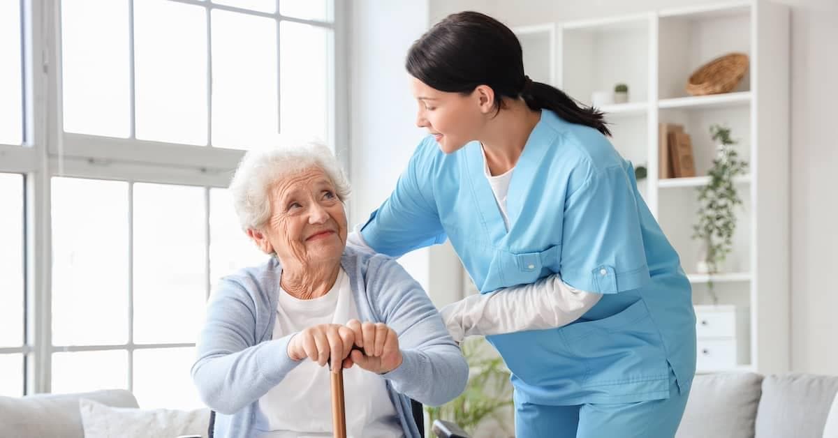 Caregiver helping elderly person